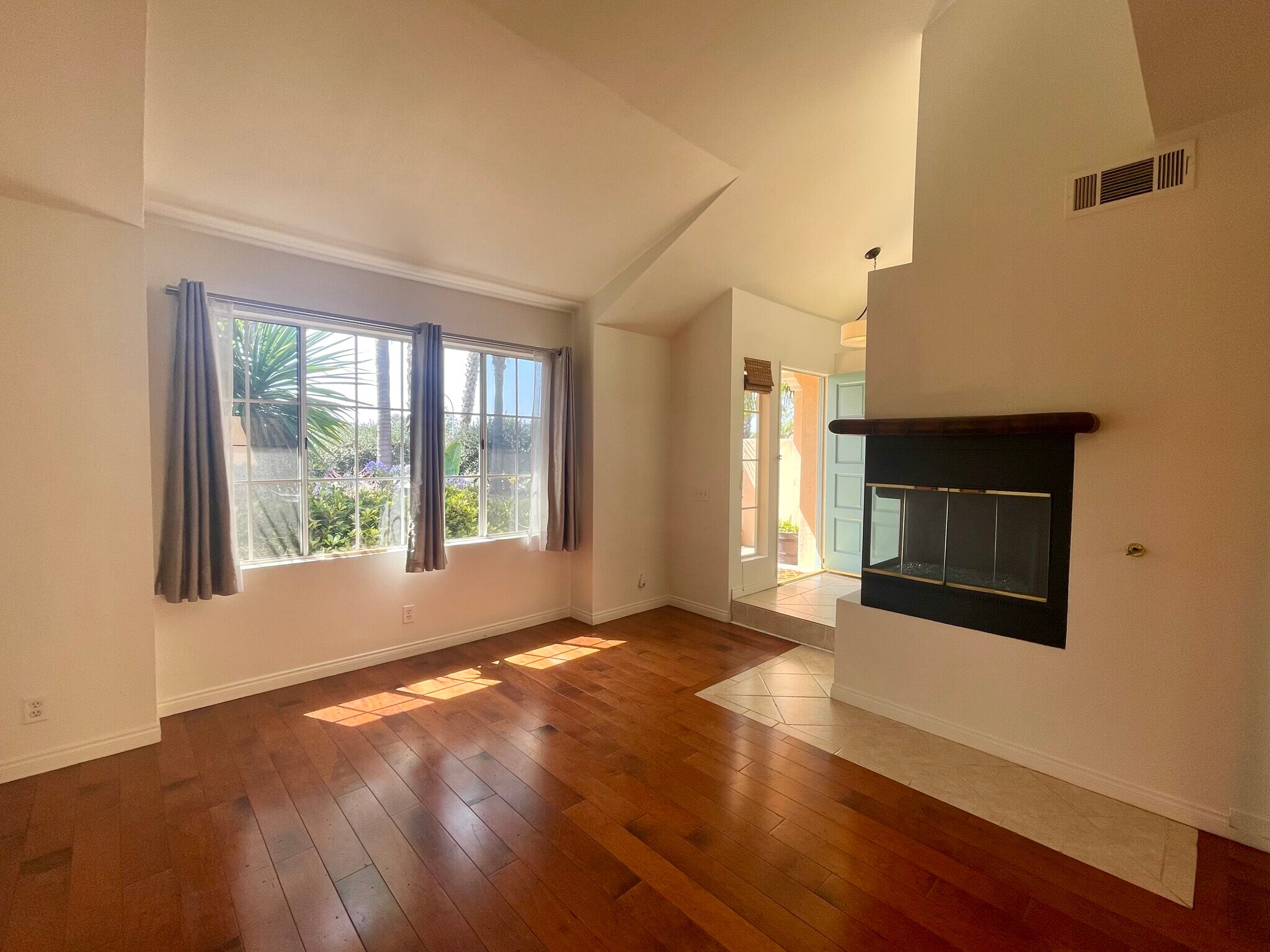 Living Room with Fireplace and Vaulted Cielings - 7102 Phelps Rd