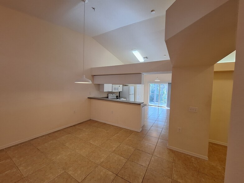 Kitchen and den on the right - 25727 Lake Amelia Way