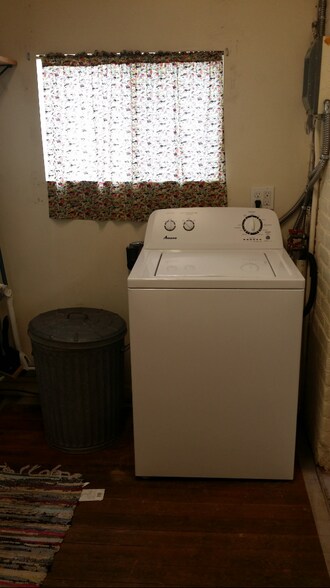 Laundry room area with view of washing machine - 607 Harrison Ave