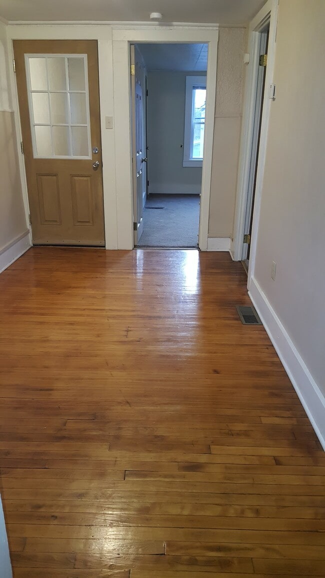 Living room looking toward bedroom & entry door - 416 Henry St