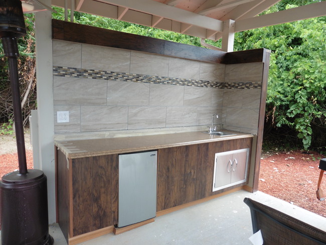 Outdoor kitchen with refrigerator and sink - 5685 Chatford Dr