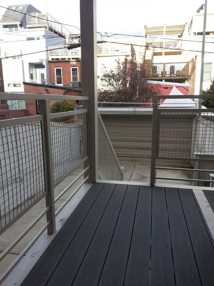 Step out onto your small private deck with direct access to a secure parking pad - 1123 6th St NW
