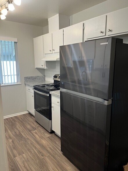 kitchen w/stove & fridge - 12436 Del Amo Blvd