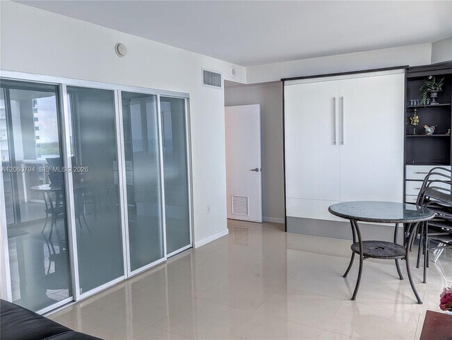 Building Photo - 10275 Collins Ave