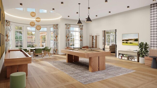 Game room with billiards, shuffleboard, poker table, and comfortable seating at Modera South Shore in Marshfield, MA. - Modera South Shore