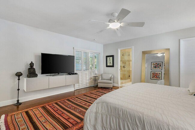 Primary bedroom overlooks patio/pool - 2535 NW 41st St