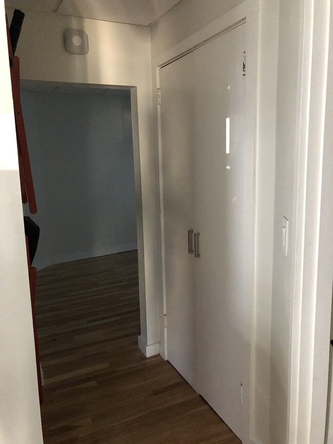 Hallway to bedroom featuring nice size closet with hanger rod and shelf. - 12 Boynton Street