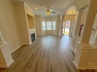 Building Photo - Beautifully updated Townhome! New cabinets, granite counter tops, and LVP flooring through downst...