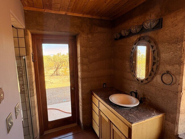 Building Photo - Desert Home on 3.3 Acres with Rooftop Views & Unique Rammed Earth Design