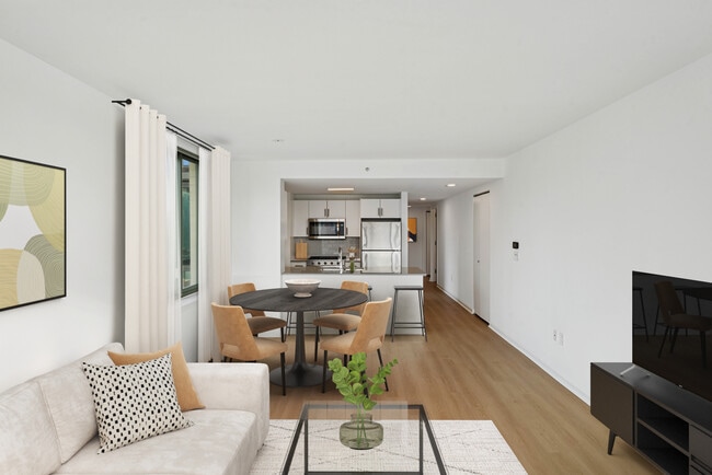 Renovated Package I dining and living room with hard-surface flooring - Avalon Riverview