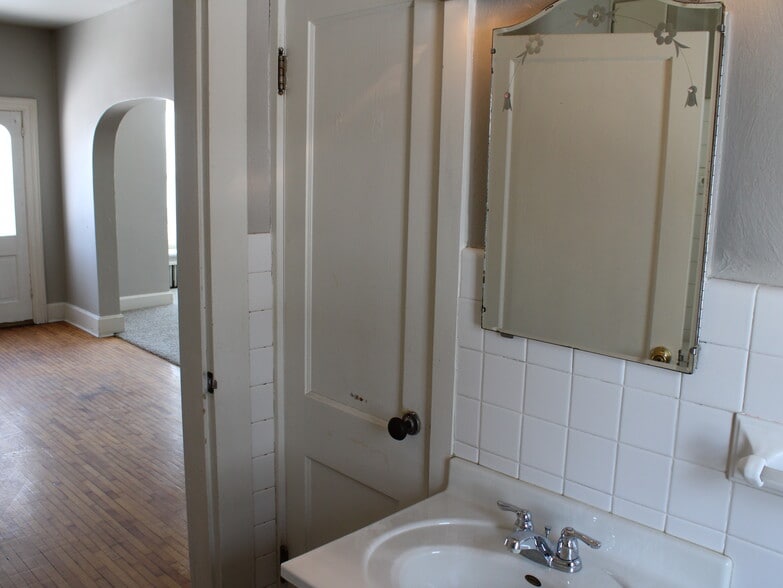 Bathroom with medicine cabinet mirror. - 28 5th St