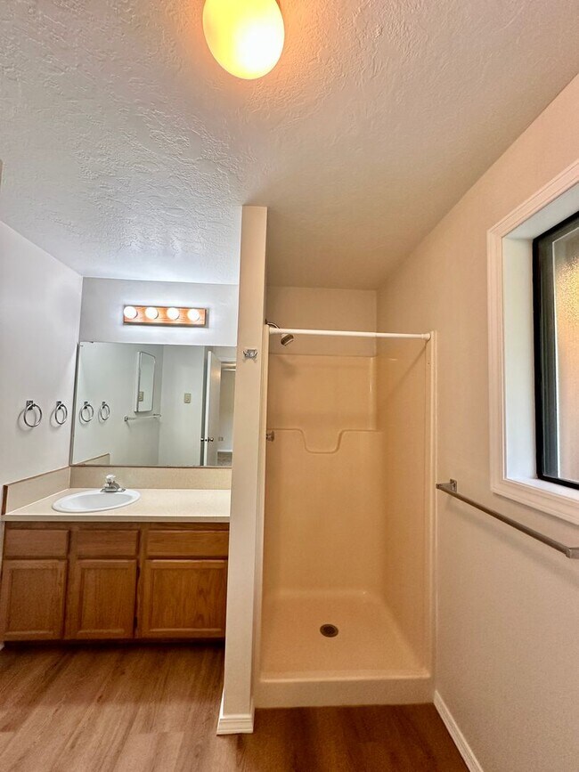 Building Photo - For Rent: Cozy 2 Bed / 2 Bath Condo with Enclosed Yard & Detached Garage