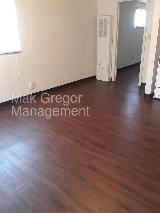 Building Photo - New Flooring, Fresh Paint, Appliances, A/C.