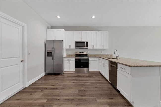 Building Photo - Brand new Duplex stocked with upgrades