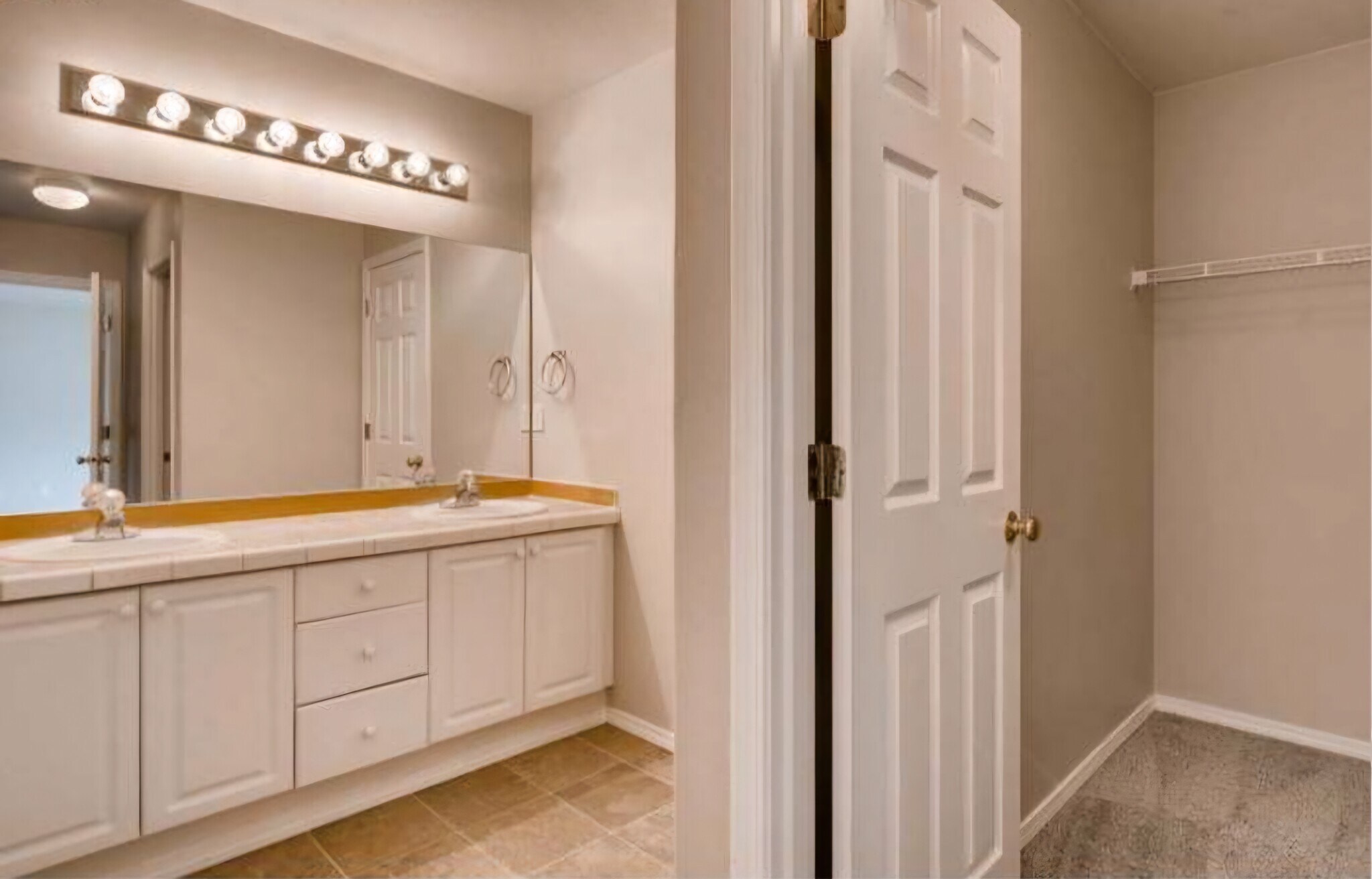 Bathroom in the primary bedroom with a walk-in closet - 5143 NE Schoeler Cir