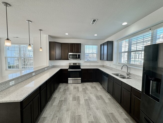 Building Photo - 3 Bedroom Townhome in Spence Crossing! Water/Sewer/Trash/Landscaping INCLUDED! - Attached Garage ...