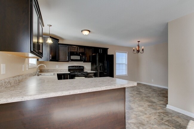 Building Photo - Charming Home Open Floor Plan with Spacious Living Room and Breakfast Bar