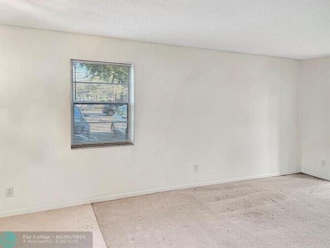 Building Photo - 6090 N Sabal Palm Blvd