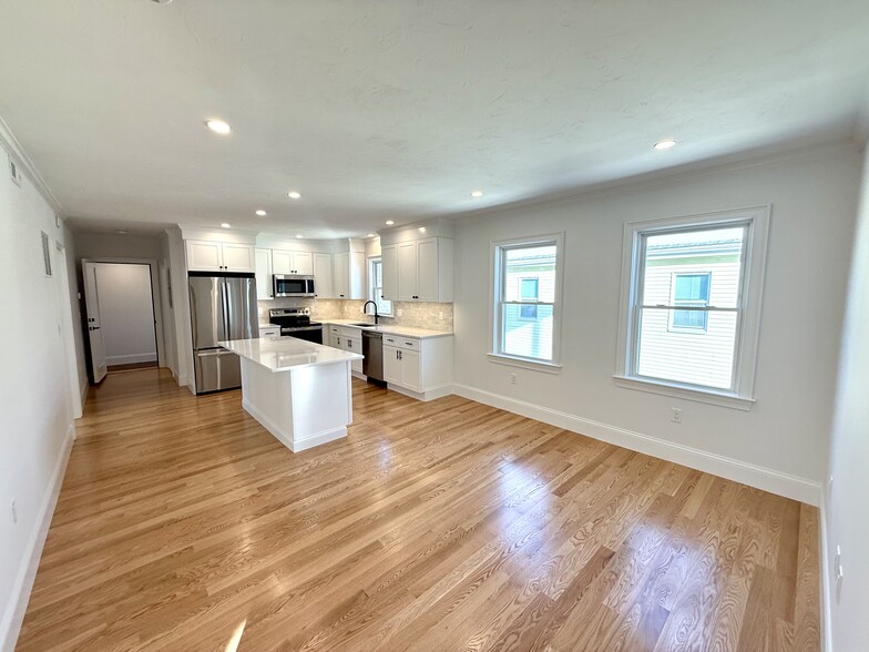 Kitchen: Brand New Stainless Steel Appliances, Quartz Countertops with Open Layout into Living Area - 34 Saint Joseph Ave