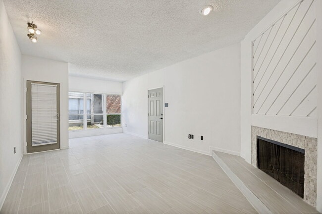 Building Photo - Spacious Dallas Condo with Unbeatable Storage, Private Patio & Carport