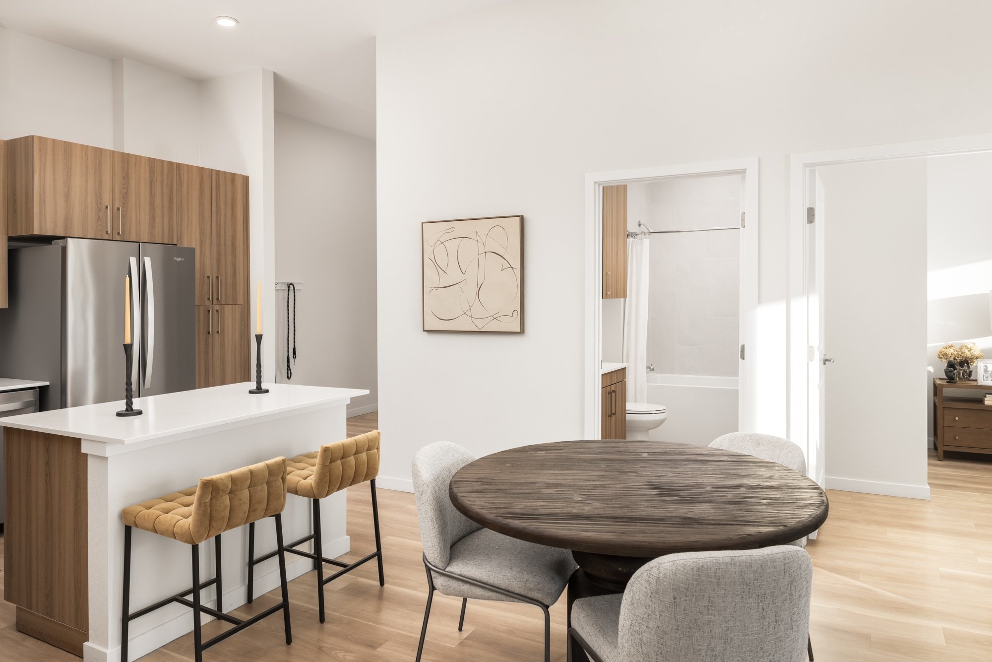 Quartz countertops with designer tile backsplashes at The Madison. - The Madison and The Fillmore at Copperleaf