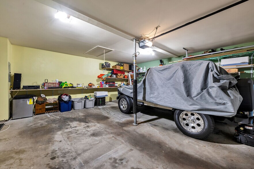Nice attached 2 car garage with attic storage. - 918 Harpeth Trace Dr