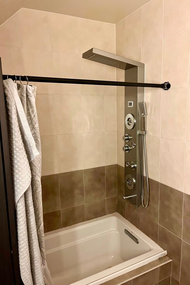 Bathroom #3 w/ rain shower, body sprays, and bathtub - 3814 Usher Ct