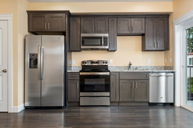 Building Photo - Sophisticated One-Bedroom Living at Marigold Apartments — Available Now