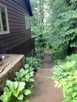 Private walkway to apartment - 5309 N River Rd