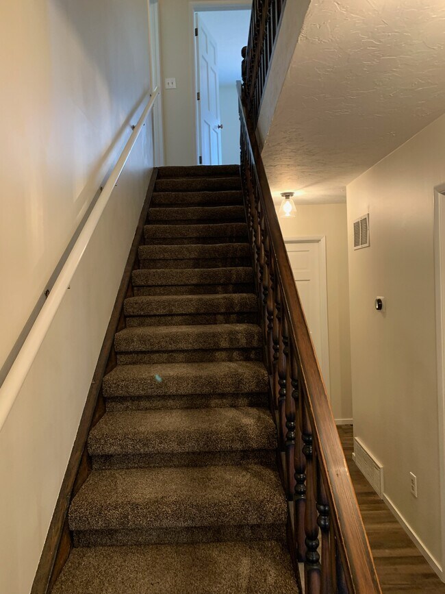 Stairs leading to 2 bathrooms + 4 bedrooms - 325 Harvard Ave