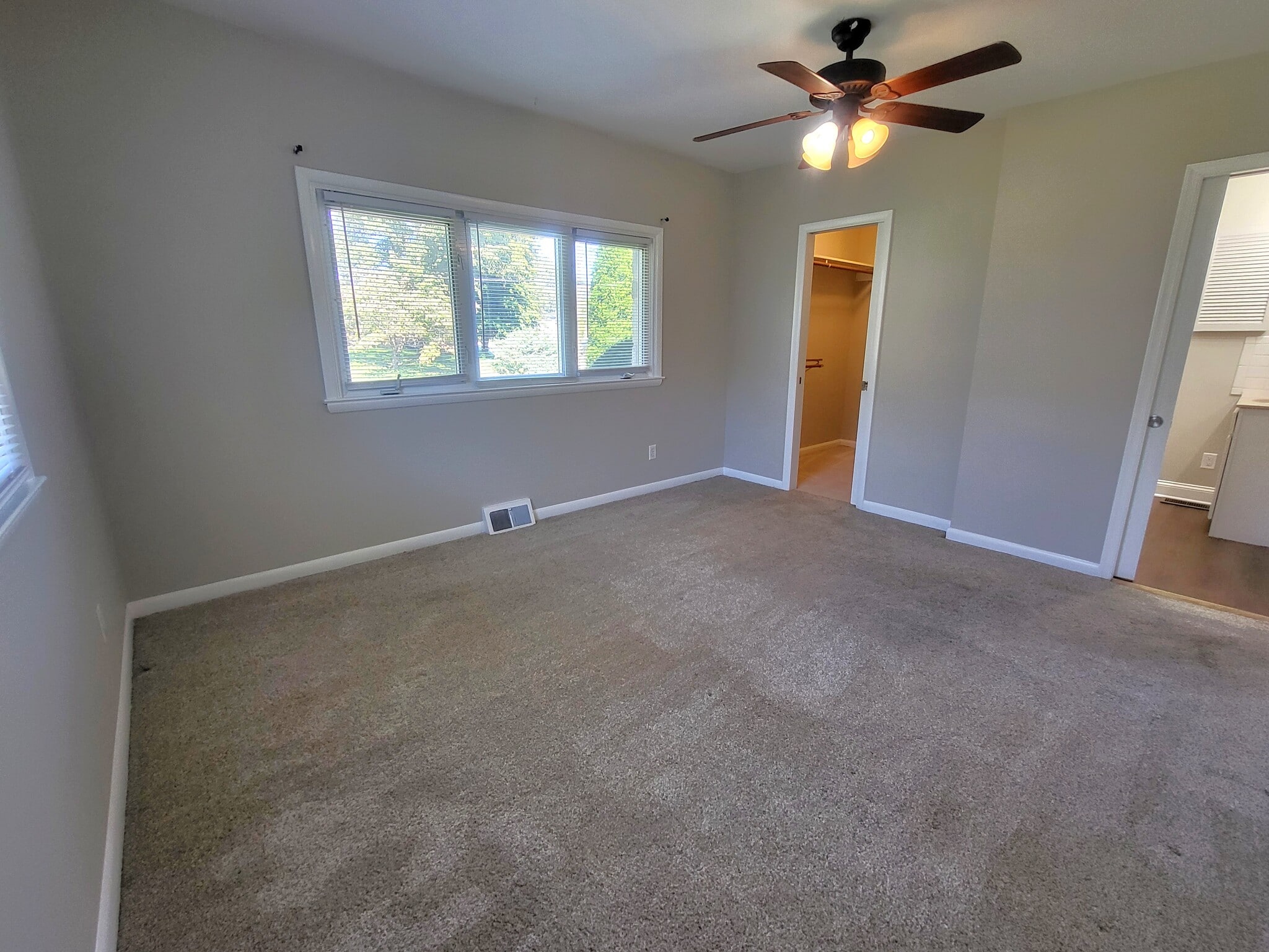 Bedroom 1 w/ceiling fan, walk-in closet and entrance to bathroom - 1429 Virginia Ave