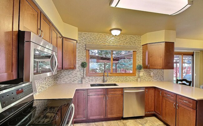 Building Photo - Spacious 4-Bedroom Home with Huge Fenced Y...