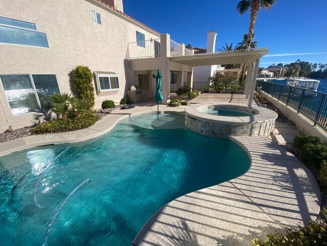 Building Photo - Vegas's Only Available Waterfront Rental ~ 4 Bedroom Desert Shores Lake Front Home