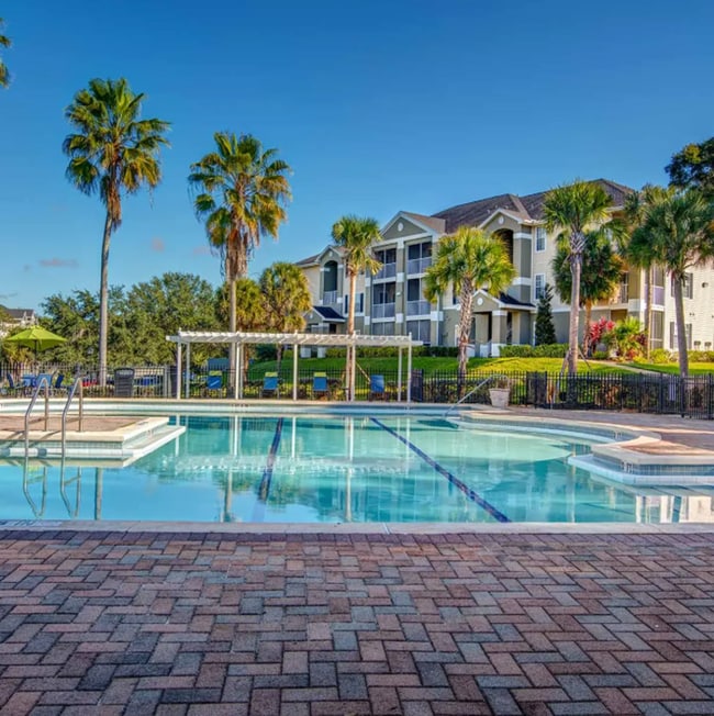 Building Photo - Beautiful 2BR/2BA Condo in Sunset Lakes – Lake & Tree Views!