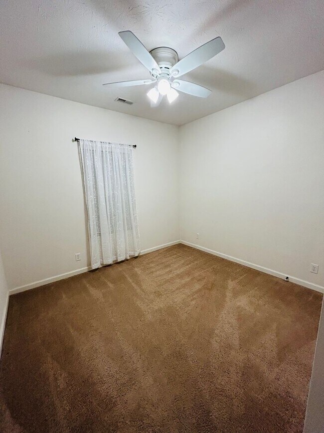 Building Photo - House with Fenced Backyard