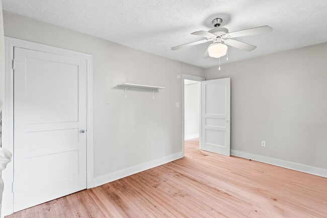 Building Photo - Charming 2BR/1BA Brick Cottage — Hardwoods, Fenced Yard, W/D Included