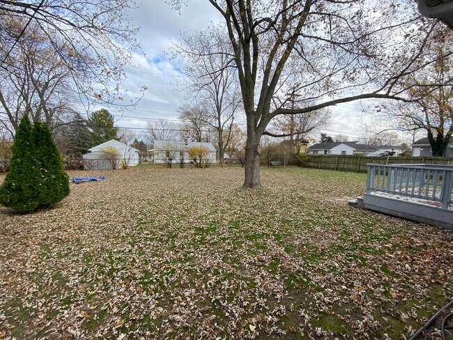 Park-like backyard sits on almost .5 an acre! - 618 Clayton Ave NW