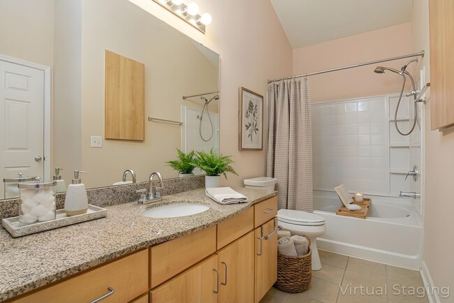 Building Photo - Bright 1-Bedroom Condo with Detached Garage in Eastwood Village Complex (Water Included)