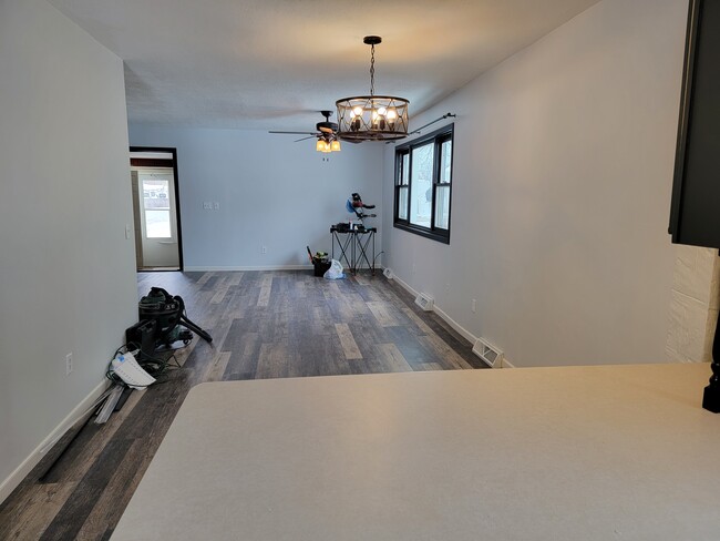 View from kitchen. New vinyl plank flooring - 204 N Ohio St