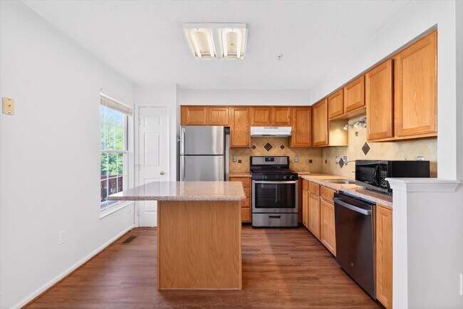 Building Photo - 3BR Townhome in Russett | 3 Levels | Walkout Basement + Deck | $2,400/mo** Beautiful 3-level town...