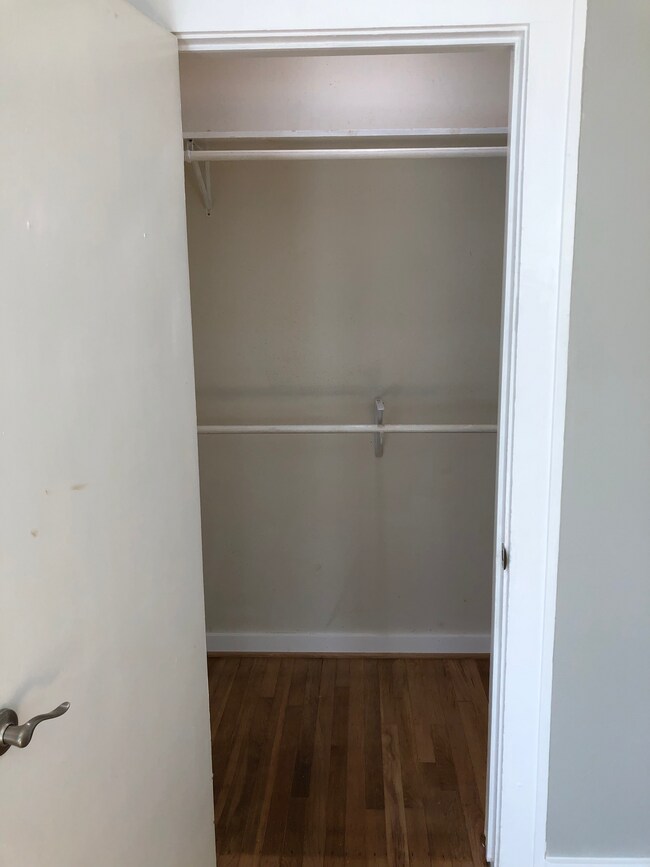 Front Bedroom Closet with Hanging Rods - 401 W Saulnier St