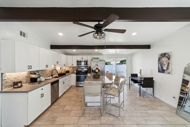 The kitchen and kitchenette are equipped with essential cooking tools - 9853 Saint George St