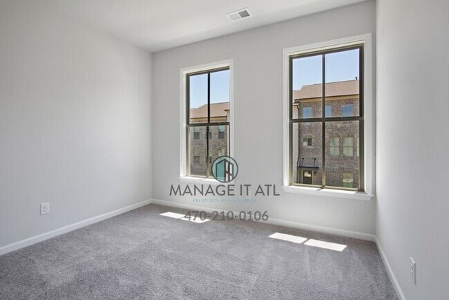 Building Photo - Modern 3-level Townhome featuring 4 bedrooms and 3 1/2 baths