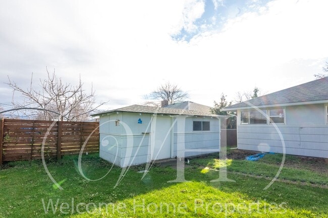 Building Photo - Spacious 5 Bedroom Home with Fenced Yard & Covered Parking