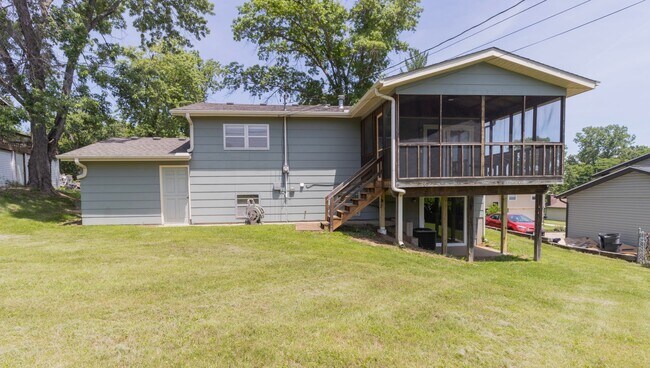 Building Photo - Charming 3BR Home-Screened Porch, Private Garage & Massive Backyard