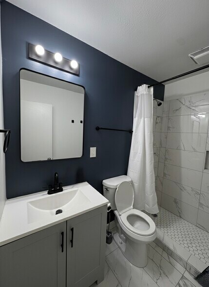 An en-suite bathroom with updated fixtures and a clean, modern feel - 2394 Bouldercliff Way SE