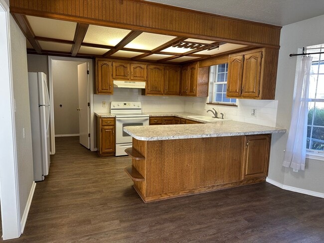 Building Photo - Clean, updated home on a corner lot with privacy fence and storage shed.