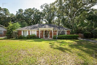 Building Photo - 3/2 Brick Home with Sunroom, Deck, and Car...
