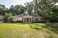 Building Photo - 3/2 Brick Home with Sunroom, Deck, and Car...