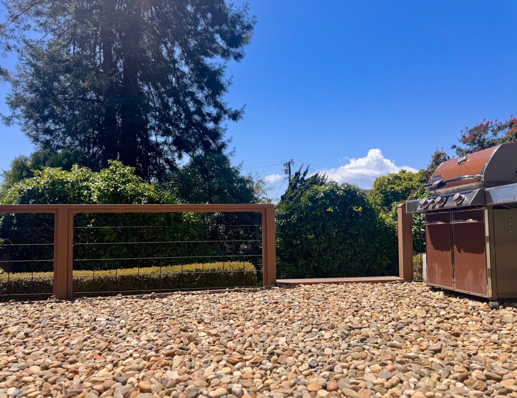 The second level offers an outdoor entertaining space with bay views and a Weber propane grill. - 2403 Mira Vista Dr